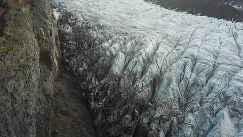 Ice Formations Under Volcanic Hills in Highlands of Iceland. Svinafellsjokull Tongue of Vatnajokull