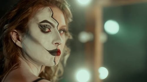Woman with Clown Makeup Looking at Camera