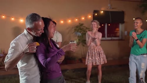 Friends Dancing at an Outdoor Birthday Party