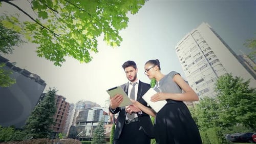 Sliding Camera of Businessman Run on Tablets Their Financial Highlights