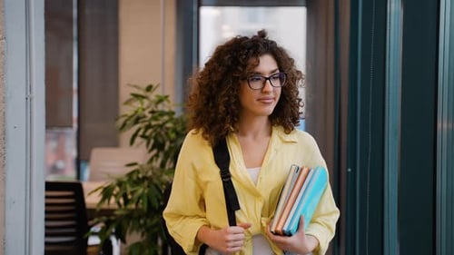 Young Female University Student Smiling in Campus Library