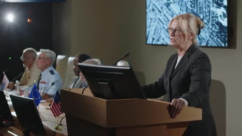 Woman Gives Speech at Corporate Conference