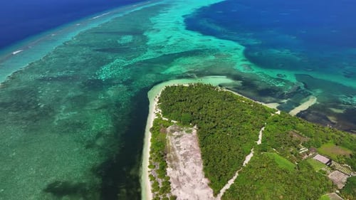 Aerial view of island and reef, Maldives.