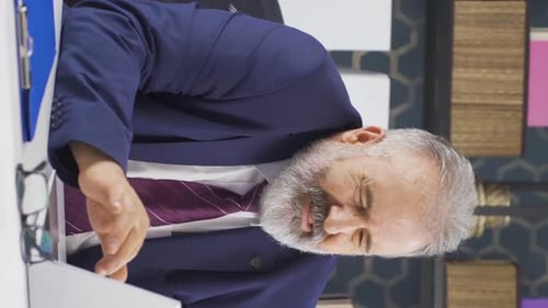 Man Rubs Neck Due to Corporate Stress