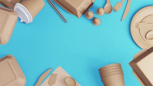 Arrangement of sustainable tableware on a blue background