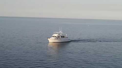 Luxury Yacht Sailing Smoothly In Open Sea On A Sunny Day. wide