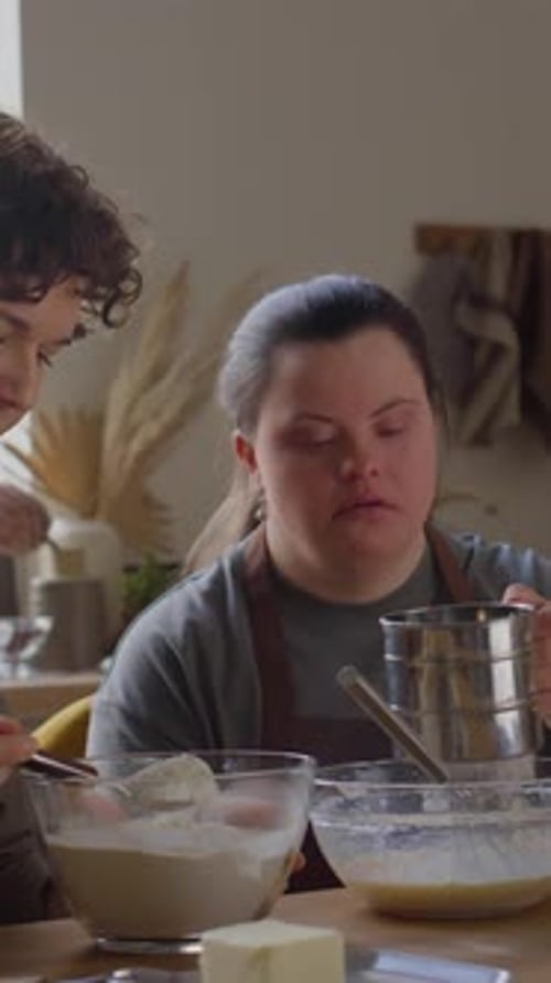 Two Women Friends Baking Sweet Treat at Home