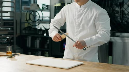 Chef Sharpening Knife with Honing Steel in Kitchen