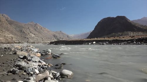 A river flowing the barren and dry desert land of northern nepal.