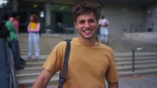 Smiling Student on Campus Steps