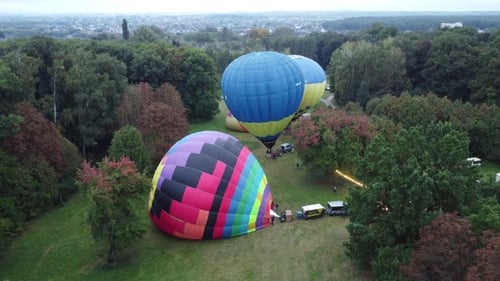 Colorful Hot Air Balloons in Rural Setting