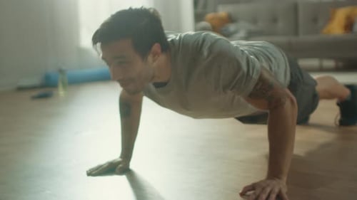 Athletic Man Doing Push-Ups in Living Room
