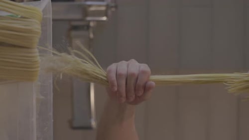Italian Pasta Being Made on the Machine for Cutting Dough Fresh Handmade Pasta Machine Rolling Dough