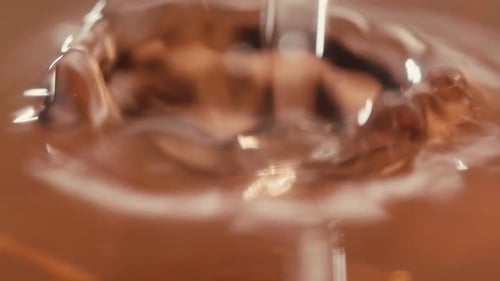 Orange or White Wine Bottle and Glass Against a Sunset in a Peaceful Vineyard Pouring of Ecological
