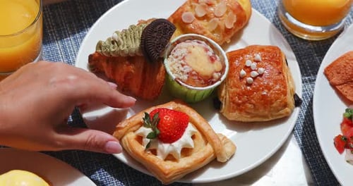 Delicious Pastries on a Plate With Orange Juice