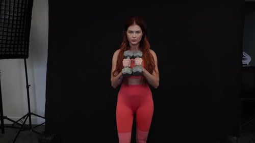 Fit Woman Working Out With Dumbbells