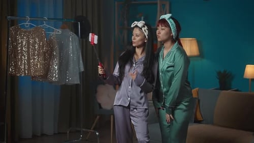 Women in Pajamas Take Fun Selfies Together