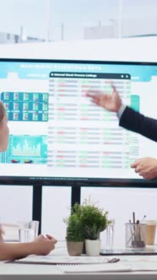 Vertical Video Broker Agent Presents Stock Market Analytics to Mother and Daughter