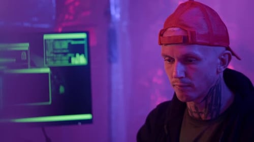 Young Adult Coding at Night on Computer