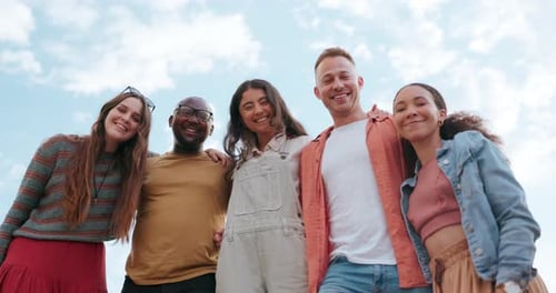 Smiling Friends Standing Together Outdoors in the City