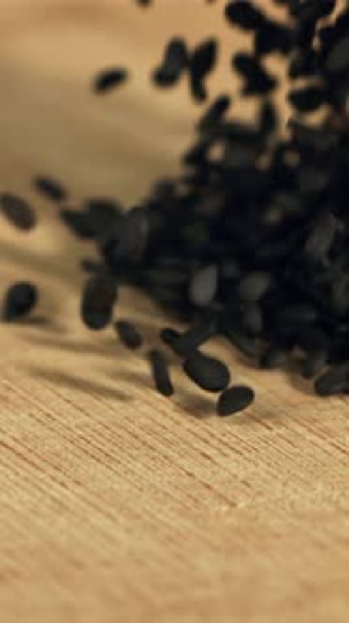 Falling Sesame Seeds on the Table