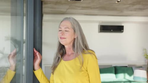 Affectionate Senior Couple Enjoying Morning Coffee Together