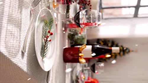 Christmas Table Setting with Decorations and Wine