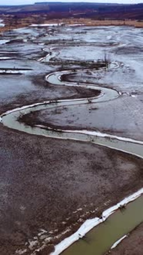 Dried lake. Ecological disaster in environment. Global warming. Tortuous river on dirty background.