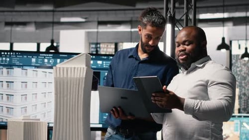 Real Estate Professionals Evaluating Property Layout for Site Preparation