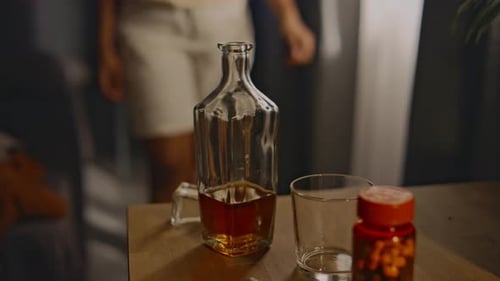 Nightstand with pills and bottle