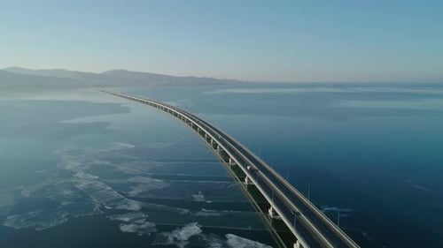 Aerial Drone View of Lowwater Bridge Across the Bay with Moving Car Active Movement of Transport
