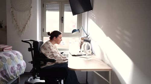 Woman Working at Computer in a Bright Room