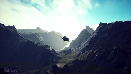 A Helicopter is Flying Over a Mountain Range