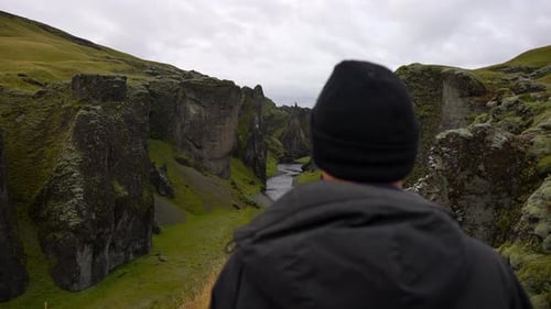 Hiker Overlooking Fjadrargljufur Canyon