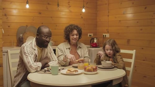 Family Eating Breakfast Together at Home