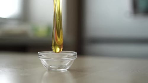 honey dripping from spoon