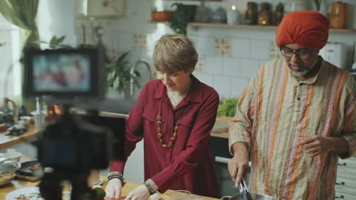 Two People Cooking Together in a Home Kitchen