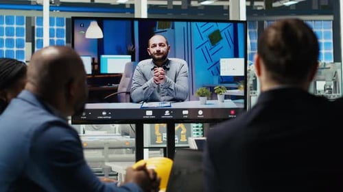 Experts Optimize Factory Equipment Energy Output During Videocall Meeting