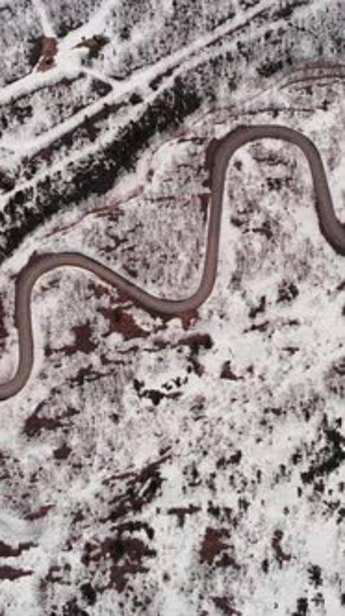 Vertical Aerial fly Mount Zao Stratovolcano, snowy winding Road and Rusty Terrain, Japan