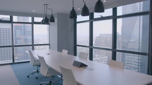 Panning Shot Of A Stylish And Modern Meeting Room In A Corporate Office With A High Building View