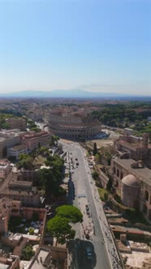 A Stunning Aerial View Showcasing Romes Iconic Colosseum Alongside Its Historic Cityscape