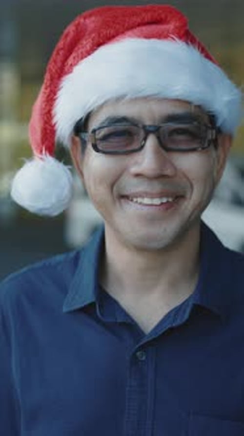 Smiling Man Wearing a Santa Hat