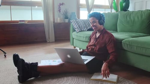 Woman Using Laptop for Online Meeting at Home