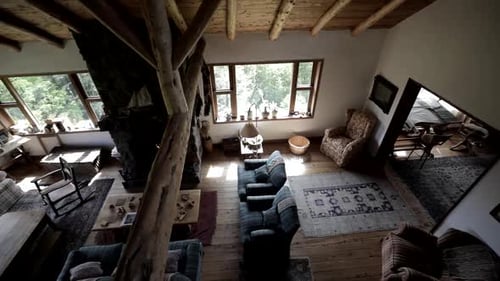 Interior view of a beautiful and comfortable log cabin with a fireplace in the living room with a fi