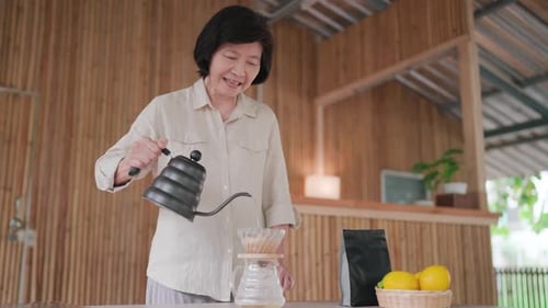 Woman Making Pour Over Coffee at Home