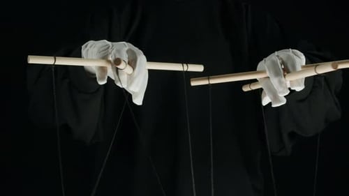 The Puppeteer Controls the Puppets in the Theater Managing People at Work in Politics and Government