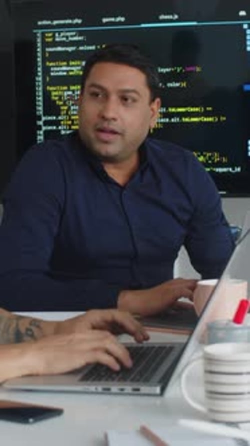 Software Developers Working Together in Modern Workplace