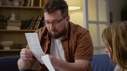 Couple reviewing utility bills together at home