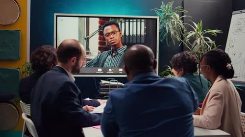 Management Team Meeting with CEO on Videocall Connection in a Boardroom