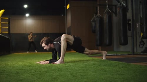 Serious Male Boxer Warming Up in Sport Club. Closeup Active Sport Man